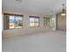 Bright living room with multiple windows and a view of the backyard at 3404 E Los Altos Rd, Gilbert, AZ 85297