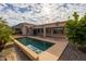 Inviting backyard oasis featuring a refreshing pool and a spacious patio at 3404 E Los Altos Rd, Gilbert, AZ 85297