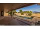 Covered patio overlooking a sparkling pool and backyard at 3404 E Los Altos Rd, Gilbert, AZ 85297