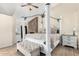 Spacious Primary bedroom with a large four-poster bed and ensuite bathroom at 3450 N 67Th Dr, Phoenix, AZ 85033