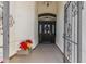 Elegant entryway with decorative gate and potted plants at 3450 N 67Th Dr, Phoenix, AZ 85033