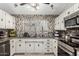 Modern kitchen with stylish backsplash and ample counter space at 3450 N 67Th Dr, Phoenix, AZ 85033