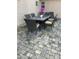 Outdoor patio shows dining table with seating and beautiful stone tile at 36014 N 3Rd St, Phoenix, AZ 85086