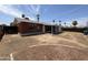 Large backyard with covered patio and gravel at 3748 W Rovey Ave, Phoenix, AZ 85019