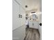 Clean bathroom with white vanity, round mirror, and gray tile floors at 3748 W Rovey Ave, Phoenix, AZ 85019