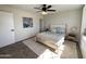 Light and airy bedroom featuring a ceiling fan and ample closet space at 3748 W Rovey Ave, Phoenix, AZ 85019