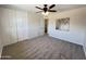 Spacious bedroom with ceiling fan, neutral wall paint and carpet at 3748 W Rovey Ave, Phoenix, AZ 85019