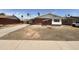 Brick ranch house with a large front yard and driveway at 3748 W Rovey Ave, Phoenix, AZ 85019