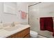 Bathroom with sink, toilet, and textured glass shower at 3813 W Glenn Dr, Phoenix, AZ 85051