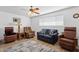 Relaxing living room with comfy seating and wood floors at 3813 W Glenn Dr, Phoenix, AZ 85051