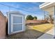 Blue and white storage shed in the backyard at 3813 W Glenn Dr, Phoenix, AZ 85051