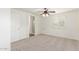 Carpeted bedroom with a ceiling fan and window at 3883 E Santa Fe Ln, Gilbert, AZ 85297