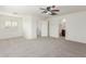 Spacious room with neutral carpet, shuttered window and view into the bathroom at 3883 E Santa Fe Ln, Gilbert, AZ 85297