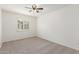 Bright bedroom featuring a window, neutral walls and carpeted flooring at 3883 E Santa Fe Ln, Gilbert, AZ 85297