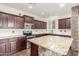 Open concept kitchen with stainless steel appliances and granite countertops at 3883 E Santa Fe Ln, Gilbert, AZ 85297