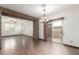 Bright living room featuring an open layout with a patio sliding door and stone features at 3883 E Santa Fe Ln, Gilbert, AZ 85297