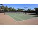 The tennis court is well maintained and equipped with lighting for evening games at 3883 E Santa Fe Ln, Gilbert, AZ 85297