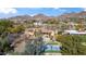 Aerial view of the home featuring a basketball court and mountain views at 4245 E Claremont Ave, Paradise Valley, AZ 85253