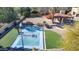 Aerial view of a backyard with a basketball court, putting green, and landscaping at 4245 E Claremont Ave, Paradise Valley, AZ 85253