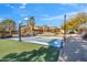 Backyard featuring basketball court and desert landscape with a large home in background at 4245 E Claremont Ave, Paradise Valley, AZ 85253