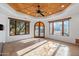 Bright bonus room with a wood ceiling, large windows, and stone floors at 4245 E Claremont Ave, Paradise Valley, AZ 85253