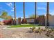 Community entrance with stone signage and desert landscaping at 4245 E Claremont Ave, Paradise Valley, AZ 85253