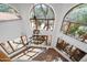 Architectural detail with hanging light fixture and multiple large pane window views at 4245 E Claremont Ave, Paradise Valley, AZ 85253