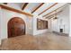 Spacious living room featuring a flagstone floor, wood beams and a decorative fireplace at 4245 E Claremont Ave, Paradise Valley, AZ 85253