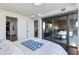 Bedroom with a walk-in closet and sliding glass doors leading to an outdoor seating area at 4422 N 75Th St # 3012, Scottsdale, AZ 85251