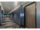 Well-lit hallway with stylish patterned carpet leading to unit 3012's front door at 4422 N 75Th St # 3012, Scottsdale, AZ 85251