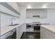 Contemporary kitchen with white cabinetry, stainless appliances and quartz countertop at 4422 N 75Th St # 3012, Scottsdale, AZ 85251