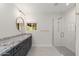 Modern bathroom with a large walk-in shower, granite countertop and dark cabinets at 4450 N 54Th St, Phoenix, AZ 85018