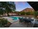 Inviting pool area with mountain views and patio furniture at 4450 N 54Th St, Phoenix, AZ 85018