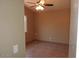 Bright bedroom with ceiling fan and tile flooring at 510 E Wickieup Ln, Phoenix, AZ 85024