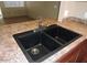 Modern double kitchen sink with chrome faucet at 510 E Wickieup Ln, Phoenix, AZ 85024