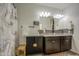 Bathroom with granite countertops, tiled backsplash, and decorative cabinet at 5267 E Diatomite Dr, San Tan Valley, AZ 85143