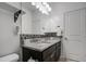 Bathroom featuring a double sink vanity with granite countertop and mosaic tile backsplash at 5267 E Diatomite Dr, San Tan Valley, AZ 85143