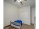 Bedroom with a blue beanbag and white sliding door closet at 5267 E Diatomite Dr, San Tan Valley, AZ 85143