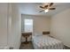 Cozy bedroom featuring a patterned bedspread and rustic wooden side table at 5267 E Diatomite Dr, San Tan Valley, AZ 85143