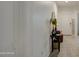 Warm home hallway with console table, decorative mirror, and tile flooring at 5267 E Diatomite Dr, San Tan Valley, AZ 85143