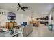 Open-concept living space with tile floors, ceiling fan, and seamless flow to the dining area at 5267 E Diatomite Dr, San Tan Valley, AZ 85143