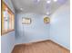 Cozy bedroom with light blue walls and hardwood floors at 530 N Miller St, Mesa, AZ 85203