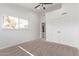 Bright bedroom with neutral carpeting and double door closet at 530 N Miller St, Mesa, AZ 85203