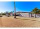 Side view of mid-century home with mature landscaping at 530 N Miller St, Mesa, AZ 85203