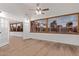 Living room with hardwood floors, large windows and French doors at 530 N Miller St, Mesa, AZ 85203