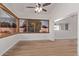 Sunlit living area with hardwood floors and expansive windows at 530 N Miller St, Mesa, AZ 85203