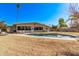 Inviting backyard oasis featuring a kidney-shaped pool at 530 N Miller St, Mesa, AZ 85203