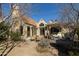 Private backyard featuring an outdoor dining area, lush plants, and a comfortable seating area at 537 W Encanto Blvd, Phoenix, AZ 85003