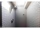 Shower stall with gray tiled walls and skylight at 537 W Encanto Blvd, Phoenix, AZ 85003