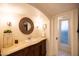 Charming bathroom featuring a stylish vanity, decorative mirror, and bright lighting at 537 W Encanto Blvd, Phoenix, AZ 85003